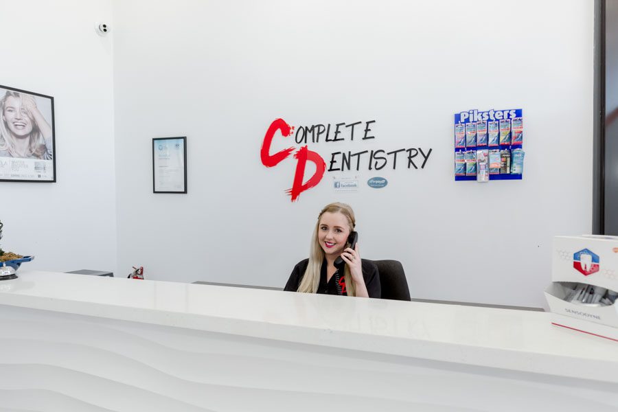 Administration assistant at dentistry counter